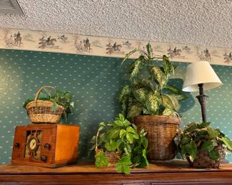 Various faux plants in baskets 