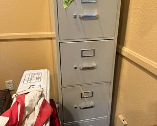 Tall and short filing cabinets in good condition. 