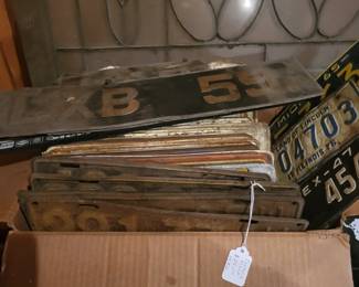 collection of vintage and antique license plates including a rare set of early motorcycle plates from Texas