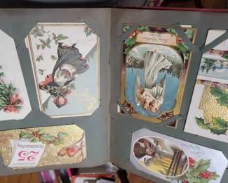 several antique postcard albums