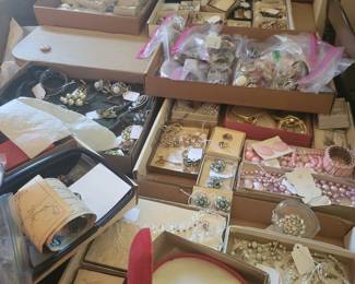 Mounds of jewelry in original boxes from Joliet's Boston Store, still in original boxes with original price tags