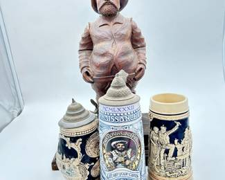 beer steins and carved wood statue