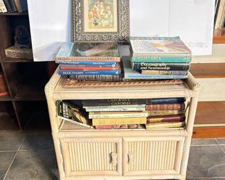 ROLLING WHITE-WASHED WICKER TABLE/CABINET WITH BOOKS