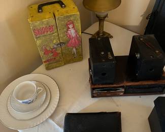 Barbies little sister skipper dressing box, Vintage desk lamp and Antique box cameras.