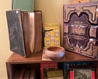 Very old Bibles, vintage books, puzzles and bookcase.