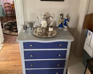 Five drawer chest and silver plate key set.