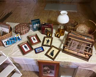 Antique loom, shadow pictures, vintage baskets, oil lamp and license plate from Panama.