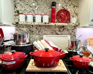 SOLD; set of 4 red and white Brasserie Williams-Sonoma mugs.  $80; artisan red and black wooden pepper mill.  $6; red rooster trivet or wall hanging.  SOLD--pair of white ridged Crate & Barrel bowls.  $80; small All-Clad roasting pan with lid.  $120; large All-Clad roasting pan with lid.   $70; All-Clad sauce pan with lid.  $70; All-Clad saucier with lid.  $130; LeCreuset heart-shaped, red dutch oven.  SOLD--LeCreuset oval-shaped, red dutch oven. SOLD--LeCreuset small dutch oven.  SOLD--LeCreuset red oval baking dish.