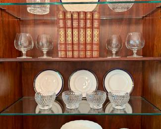 $120; Waterford crystal biscuit barrel and lid; 5x7.   $1200; 84 piece set of "Howard" Royal Worcester china with navy blue and gold rim.  $80; Atlantis crystal decanter; 7x3x10.   $48; set of 4 snifters.   $120; set of 6 leather-bound William Faulkner books.  $50; set of 4 dessert bowls.  $48; crystal serving bowl.  $1000; Herend cache pot with handles and floral detail; 10.5x6.5.   $48; crystal round vase.
