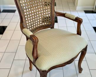 $400; caned back, custom-upholstered arm chair; 23x18x37