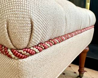 SOLD; custom-upholstered and piped tufted bench on casters by Charles Stewart Co; close up view of piping detail; 53x24x19