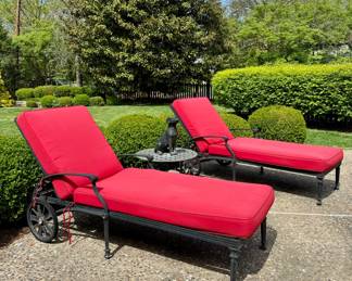 SOLD--metal chaise lounge with rear wheels and red pad.    $48; round, outdoor side table; 25x16