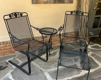 A total of 4 very heavy duty wrought iron chairs