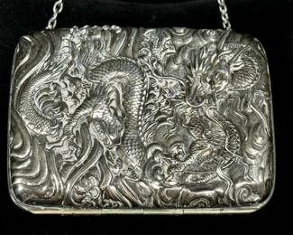 Dragon minaudiere with applied silver and highly embossed on both sides