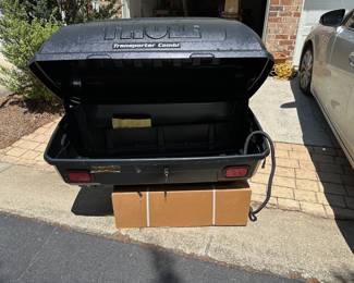 Hitch mounted Thule carrier.  Never used.  Mounting hardware in cardboard box.
