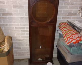Master clock case in basement 