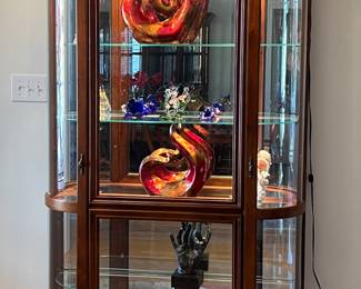 Curved curio cabinet with lighting