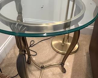 Glass top table with brass base