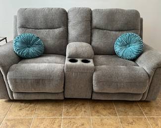 Ashley Furniture velour reclining loveseat with storage and cup holders