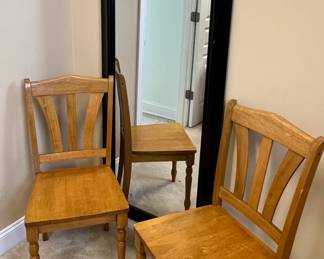 Large floor mirror with maple wood chairs