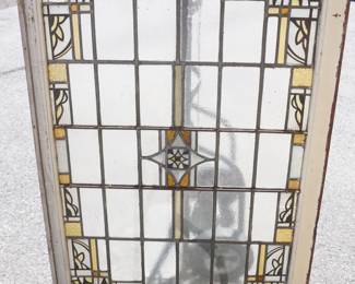 1040	STAIN GLASS WINDOW WITH LOSS TO SOME PANELS, APPROXIMATELY 35 1/2 IN X 48 IN OVERALL
