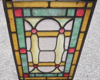 1041	ANTIQUE STAIN GLASS WINDOW WITH JEWELS, SEVERAL PANELS WITH CRACKS, APPROXIMATELY 15 1/2 IN X 21 3/4 IN
