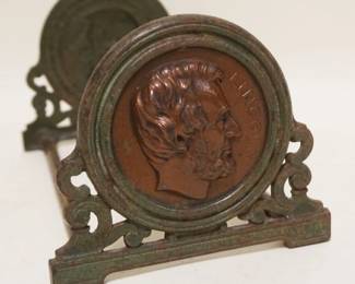 1101	ANTIQUE CAST METAL ABRAHAM LINCOLN ADJUSTABLE BOOK ENDS,CLOSED APPROXIMATELY 9 1/2 IN X 5 1/2 IN H, OPEN 14 1/4 IN
