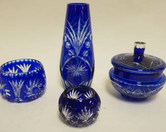 1052	BOHEMIAN GLASS COBALT CUT TO CLEAR 4 PC. ASSORTMENT INCLUDING VASE, COVERED DISH AND SMALL BOWLS, TALLEST PIECE APPROXIMATELY 9 IN H
