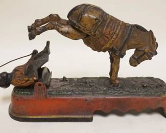 1090	ANTIQUE CAST IRON MECHANICAL BANK, *I ALWAYS DID SPISE A MULE*, PATD APR 27 1897, APPROXIMATELY 3 IN X 10 IN X 6 IN H. MISSING COIN ACCESS PLUG
