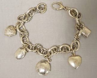 1245	STEERLING SILVER CHARM BRACELET WITH LOCKETS, APPROXIMATELY 8 IN LONG, MARKED FINOZA. 1.5 TOZ
