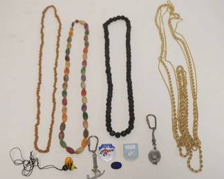 1232	ASSORTED NECKLACES INCLUDING MONET TRIPLE STAND CHAIN, MYRRH BEAD NECKLACE, PINS, AND KEY CHAINS
