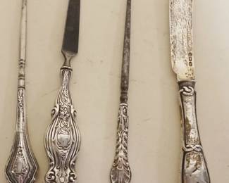 1065	STERLING SILVER HANDLED BUTTON HOOKS, NAIL FILE AND PRESENTATION BUTTER KNIFE
