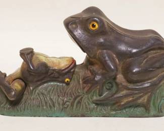 1092	ANTIQUE CAST IRON MECHANICAL BANK , FROG, FROG HAS GLASS EYES, APPROXIMATELY 9 IN X 3 IN X 4 1/2 IN H
