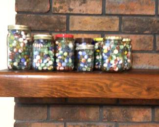 Lots of jars of vintage glass marbles