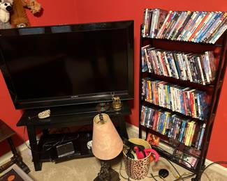 TV & stand , bookcase with DVD’s - First bedroom on left