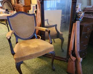 Antique velvet armchair, gun stocks. 