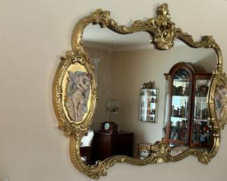 Large, ornate gold leaf mirror. 