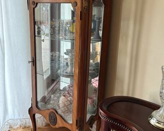 One of several gorgeous curio cabinets. 