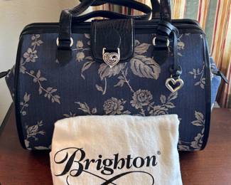 Brighton purse with dust over. 