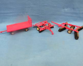 Lot 195. Three Ertl farm toys