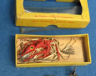 Lot 275. Two vintage 1 1/2" Hawaiian Wigglers. One box with papers.