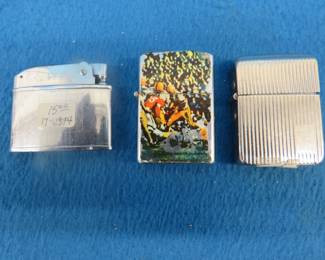 Lot 220. Three lighters in an old postcard box