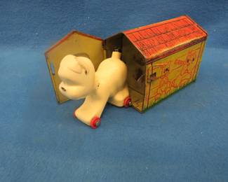Lot 21. "Pooch" pop-out toy dog.  Dog pops out when latch is depressed.  Works good.