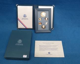 Lot 351. 1987 US Mint Prestige Set. The dollar coin is .900 pure silver .8593 troy ounce