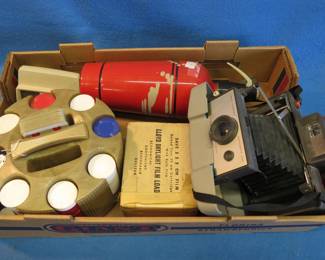 Lot 393. Poker chips, Polaroid camera and more