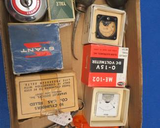 Lot 212. Vintage volt meters, oil cans, gas cap, and more