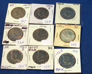 Lot 377. Nine slabbed post 1970 high-grade Kennedy Halves