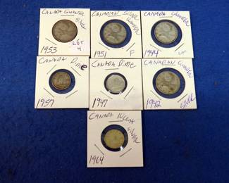 Lot 376. Four silver Canadian quarters and three silver Canadian dimes
