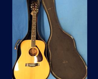 Lot 17. Yamaha FG-345 acoustic guitar in excellent condition.  Includes case and strap.  For extra $ we will keep Tony from singing and playing foir you.