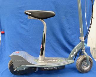Lot 18. Razor electric scooter in very good working condition with charger